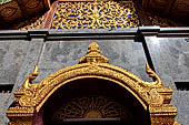 Chiang Mai - Wat Phra That Doi Suthep. Detail of the torana of the entrance of one of the two largest vihan of the temple. 